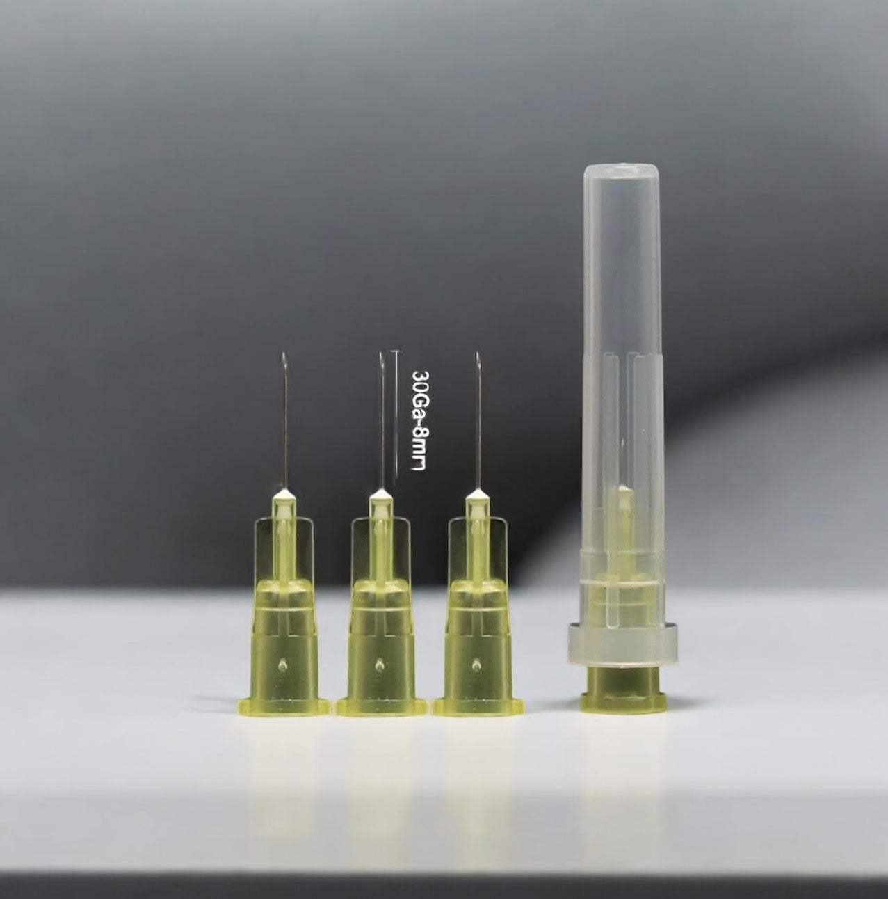 8mm 30 gauge needles, sterile and single-use, displayed with and without packaging.